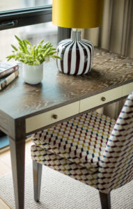 transitional desk, small desk, upholstered desk chair, striped lamp base, yellow lamp shade