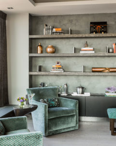 Transitional living room, green, tonal, transitional side table, living area, transitional sitting area, custom millwork, floating shelves, built in storage, bookshelf niche