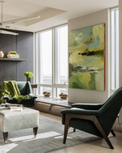 Transitional living room, green, tonal, abstract art, apple green, darkwood, den, living area, custom millwork, floating shelves, contemporary wood paneled wall, lacquer kitchen, mohair chair