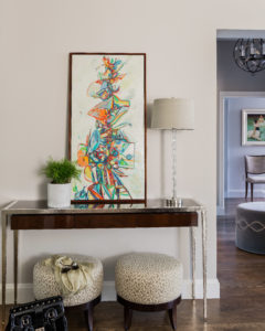 contemporary console table, metal legs console table, transtional entry foyer, contemporary art, abstract art, upholstered ottomans