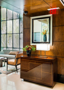 Lacquered wood, custom furniture, console, sideboard, metal details, metal inlay, brass inlay, contemporary wood paneled wall, commercial project, boston, hotel, common space, lobby
