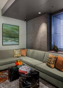 Sectional sofa, commercial project, boston, hotel design, common space, lobby, marble coffee table, stone wall, abstract rug, contemporary living room