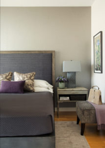 Transitional bedroom, master bedroom, modern, contemporary, upholstered headboard, city view, tonal, elegant, platform bed, purple, white duvet, wallpaper, accent wall