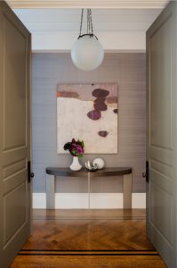 grasscloth wallpaper,globe pendant,half moon console table,modern art,purple,textured wallpaper,entry table,double entry doors