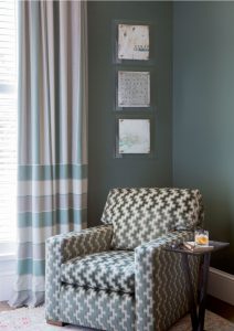 blue walls,teal walls,reading nook,drinks table,martini table,patterned upholstery,teal upholstery,monochromatic,striped dapery