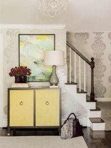 baudelaire wallpaper, oversized baudelaire wallpaper, silver wallpaper, glamorous wallpaper, yellow accent cabinet, yellow console, modern art, contemporary entry, transitional entry furniture