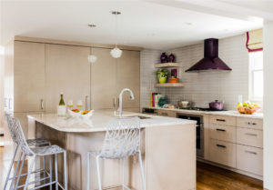 Purple hood, eggplant purple hood, grey subway tile backsplash, contemporary kitchen island, colorful accents, fun kitchen, open kitchen shelving, fully integrated refrigerator,