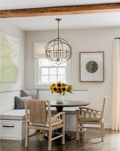 transitional breakfast nook, custom banquette, banquette seating, custom café curtain, natural wood dining chairs, transitional chandelier, cage chandelier