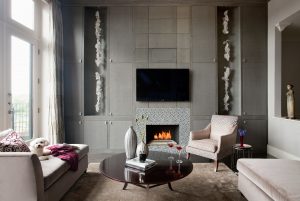 built-in storage,contemporary art,contemporary living room,custom millwork,gas fireplaces,modern sculpture,picture windows,red coffee table,three dimensional art