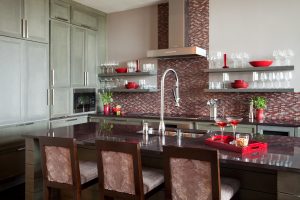 Contemporary kitchen design, bar stools and counter stools,transitional kitchen,double basin stainless steel sink,floating shelves,red granite countertop,integrated refrigerator,kitchen backsplash,red backsplash,stainless range hood