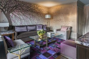 armless lounge chair,courtyard,cowhide rug,geometric rug,glass and metal coffee table,indoor-outdoor living,outdoor fireplaces,party room,purple,velvet sofa