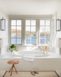 transitional bathroom design, soaking tub, lake view bathroom, white bathroom, transitional bathroom sconces