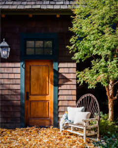 modern rustic home, lakehouse exterior, stained shingles, green exterior trim, green front door