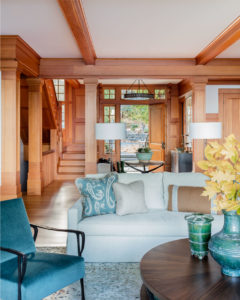 modern rustic lakehouse, transitional living room, interior decorative columns,contemporary chandelier,entryway furniture,lakehouse,lakeside view,living room furniture,picture windows,relaxed living room,stained moulding,velvet side chair,warm wood,wood flooring,wood panel wall,wood paneling,wood stairs