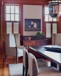 transitional dining room, rustic buffet, antique buffet, antique sideboard, decorative interior columns,decorative ceiling beams, wood beams, transitional dining room furniture,distressed wood dining chair,lakehouse,lakeside view,stained moulding,interior shutters,