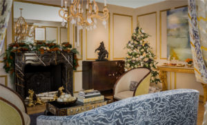 holiday decorations,living room,marble fireplace, modern, transitional, transitional Christmas tree, gold accents,ornate living room, blue velvet sofa, gold moulding, antiques