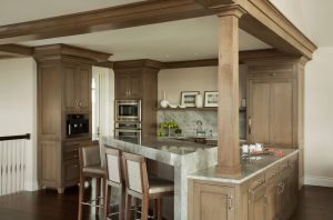 Small kitchen design ideas, dual ovens, fully integrated refrigerator, polished stone backsplash, marble backsplash, waterfall edge kitchen island,