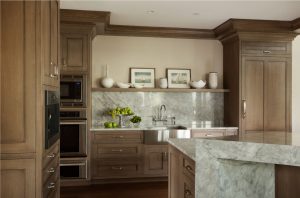 Small kitchen design ideas, dual ovens, fully integrated refrigerator, polished stone backsplash, marble backsplash, waterfall edge kitchen island,