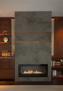 Contemporary stone fireplace surround, gas fireplace surround design, transitional living room, dramatic fireplace surround, custom millwork, floating shelving, home bar, custom dry bar, custom fireplace surround