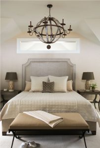 transitional master suite, bedroom with natural elements, neutral color pallete bedroom, transitional iron chandelier, transitional bedroom, upholstered headboard, end of bed bench