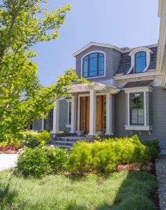 New England beach house, New England home exterior, transitional home exterior, gray exterior paint, white exterior trim, seaside home design, beach house design