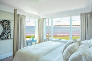 transitional bedroom, bedroom with ocean view, contemporary art, white bedroom, neutral bedroom