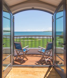 Interior French doors to balcony, ocean view home, beach house balcony, arched doorway