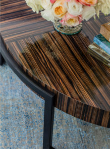 alternating wood grain coffee table, contemporary coffee table, round lacquered wood coffee table, transitional living room