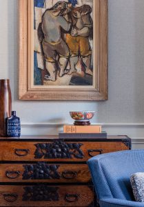 traditional chest, antique chest, artwork, blue chair, accessories