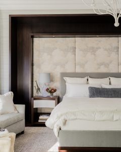 night stand, side table, night table, bedside table, upholstered bed, upholstered headboard, upholstered end of bed, bedding, bed pillows, area rug, crystal lamp, table lamp, white chandelier