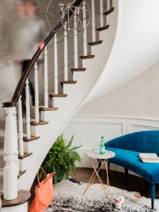 mini settee, mini bench, bench for small spaces, small bench, bright blue, vibrant blue, traditional staircase, hide rug, round side table, round chandelier, Saturn chandelier