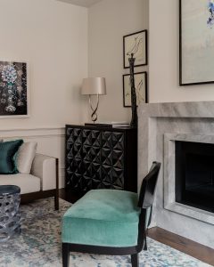 artwork, sculpture, custom cabinet, glass and wood cabinet, geometric cabinet, fireplace, pops of color, accent pillows, decorative pillows, table lamp, area rug