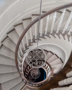 spiral staircase, staircase, grand staircase, traditional, wood floor, modern chandelier, Saturn chandelier, sphere chandelier